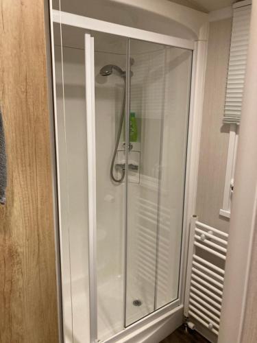 a shower with a glass door in a bathroom at Sunflower Lodge, Lido Leisure Park, Knaresborough in Knaresborough