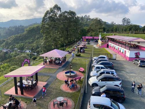 an aerial view of a parking lot with cars parked at Hotel Entre Lomas in Santa Rosa de Cabal