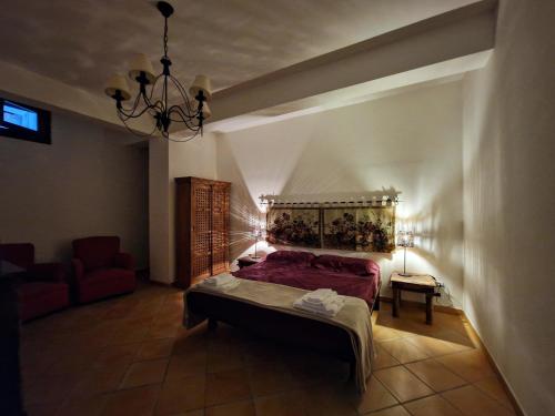 Ένα ή περισσότερα κρεβάτια σε δωμάτιο στο Villa del Carrubo a due passi dal mare di Cefalù