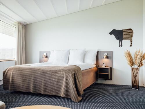 Postel nebo postele na pokoji v ubytování Hotel Føroyar