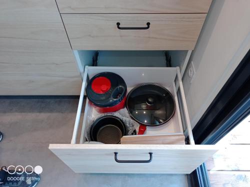 a washer and dryer in a drawer in a room at Le Ti-punch in Rivière-Pilote