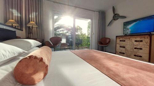 a bedroom with a large bed with a large window at Refresh Boutique Apartments in Vodice
