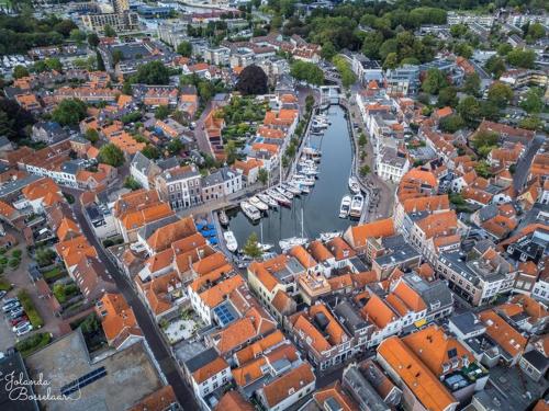 an aerial view of a city with a marina at Hotel De Grote Kade - Boutique Heritage Hotel in het historische hart van Goes in Goes