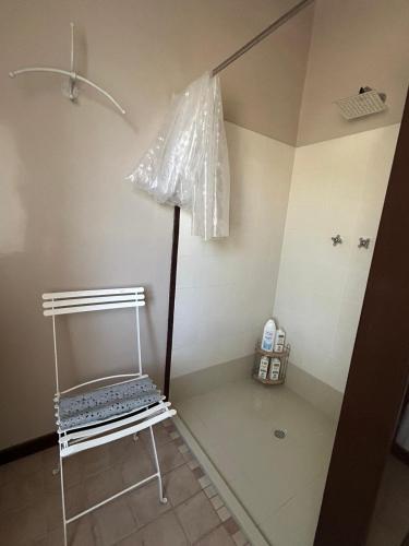a room with a table and a stand in a room at Bed&Breakfast La Madonnina in Marlia
