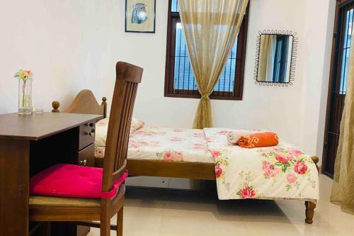 Postel nebo postele na pokoji v ubytování Catherine Villa in Ja Ela near Colombo Airport Expressway Exit