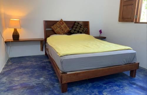 Un pat sau paturi într-o cameră la Casa Alemán