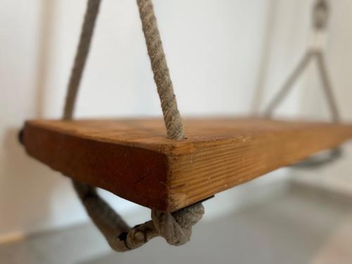 a close up of a wooden table with a metal frame at Due Di Tutto in Ferrara