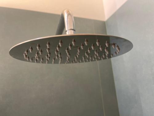 a shower head is hanging from a ceiling at Due Di Tutto in Ferrara
