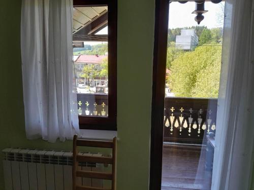 a view of a balcony from a room with a window at Willa Dniestrzanka in Krynica Zdrój