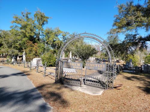 a cemetery gate with a cemetery authority sign on it at The Craft House in Wilmington
