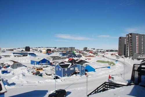 a small town covered in snow with buildings at Vandrehuset 2 og 3 in Nuuk