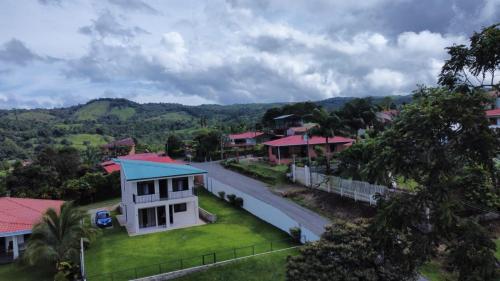 arial view of a house with a road at Arenal Vistas del Paraiso in Nuevo Arenal