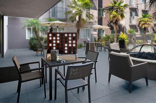 a patio with a table and chairs and a large ball at Residence Inn by Marriott San Diego Downtown in San Diego
