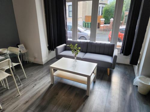 a living room with a couch and a coffee table at Amazing - 1BDR - Free Street Parking in Wolverhampton