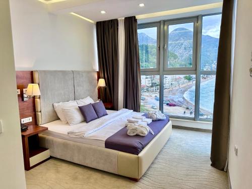 Postel nebo postele na pokoji v ubytování Hotel Porto Sole