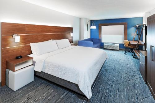 a hotel room with a large bed and a desk at Holiday Inn Express El Paso-Central, an IHG Hotel in El Paso