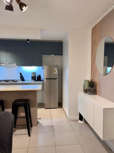 a kitchen with a refrigerator and a counter top at Caldera Apartment in Caldera