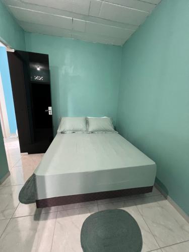 เตียงในห้องที่ Suite 2 - Green Praia bonita hospedagem