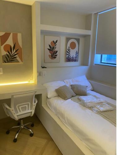 Ένα ή περισσότερα κρεβάτια σε δωμάτιο στο Flats Uberlândia
