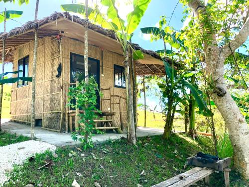 a small wooden house with a tree in front of it at Sobral Rice Terraces View in Antihon