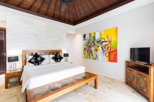מיטה או מיטות בחדר ב-Kejora Beachfront Estate Sanur - Luxurious Villa Seven Kejora