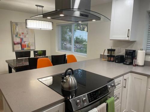a kitchen with a tea kettle on a stove at Grace's View, full kitchen, close to skiing in Sandy