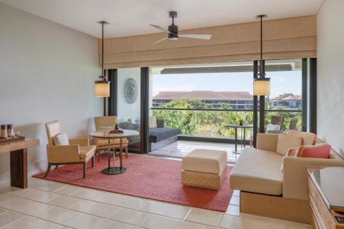 a living room with a couch and a table at The Ritz-Carlton Bali in Nusa Dua
