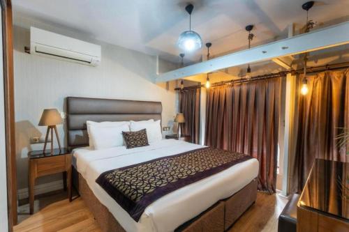 a bedroom with a large bed and a window at Node Dreams in Pulosirih
