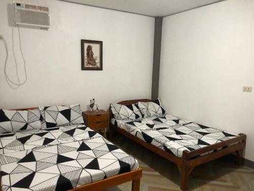 Кровать или кровати в номере TRADITIONAL PRIVATE GUESTHOUSE in PATAR BEACH