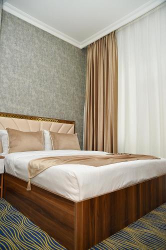 Кровать или кровати в номере Boulevard Rigs Boutique Hotel
