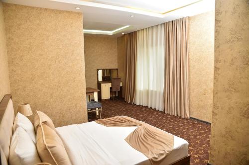 Кровать или кровати в номере Boulevard Rigs Boutique Hotel