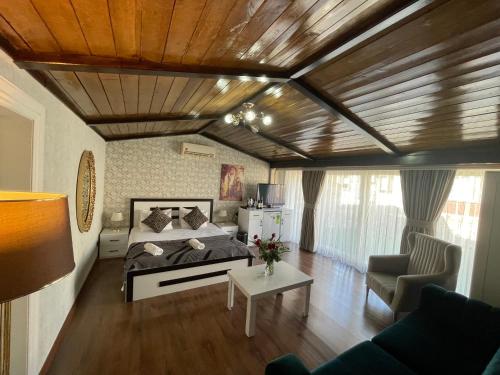 a bedroom with a bed and a living room at Es Moda in Istanbul