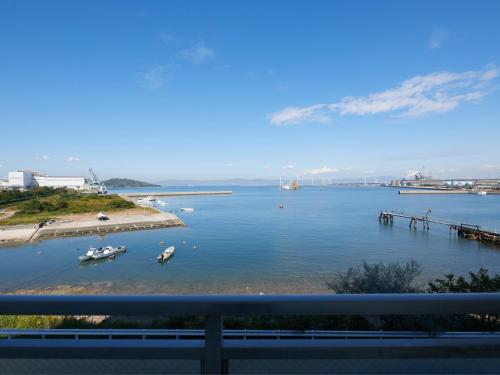 a view of a body of water with boats in it at Wind City Hotel in Tahara
