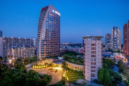 a tall building in a city at night at Wyndham Putian Downtown in Putian
