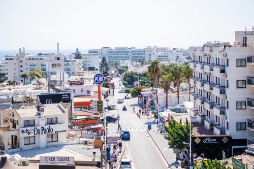 an aerial view of a city street with buildings at Kapetanios Bay Hotel Protaras in Protaras