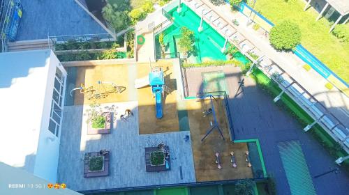 an overhead view of a swimming pool with a pool at Mactan Newtown Beach Condo in Mactan