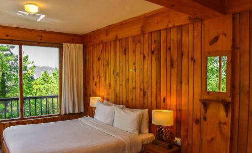 Gali's End By Roomy, Kalabagh Nathiagaliにあるベッド