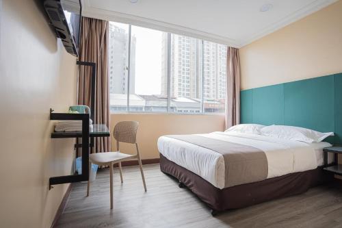 Postel nebo postele na pokoji v ubytování Hotel 28 Titiwangsa