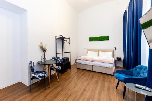 Posteľ alebo postele v izbe v ubytovaní Adagio Downtown Rooms