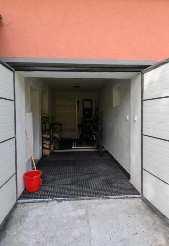 an empty garage with a red bucket in it at Kovářská vyhlídka in Kovářská