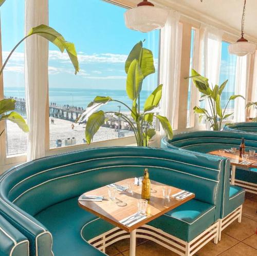 a restaurant with a view of the beach at Heart of Henley - A Homey Hideaway by the Beach in Adelaide