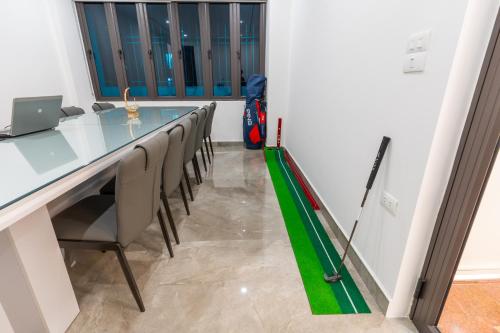 a conference room with a long table and chairs at CM Hotel & Apartment in Hai Phong