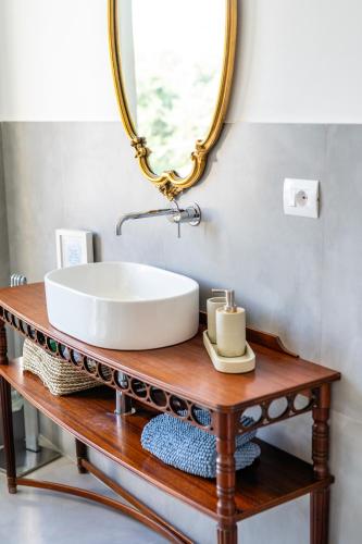 a bathroom with a sink and a mirror at Helianthus in Il Romito
