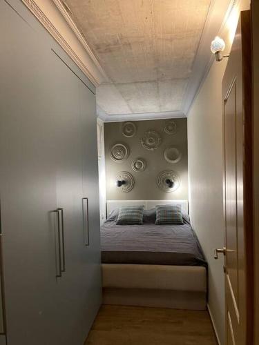 a small bedroom with a bed in a room at Garden Rovinj in Rovinj