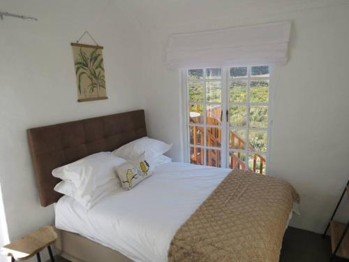 Ένα ή περισσότερα κρεβάτια σε δωμάτιο στο River Cottage