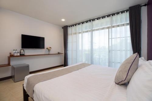Katil atau katil-katil dalam bilik di Aspira Resort Klong Muang Krabi