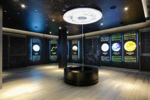 an astronomy room with planets on the wall at Hotel Vema in Visoko