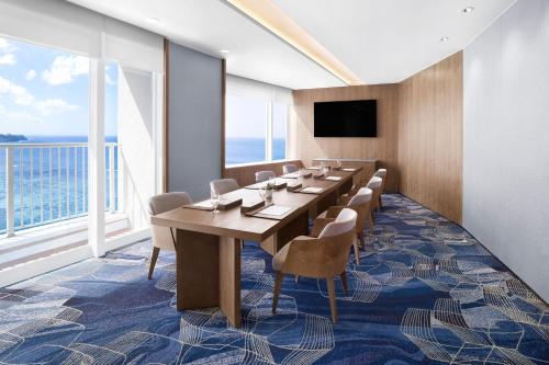 a conference room with a long table and chairs at The Westin Resort Guam in Tumon