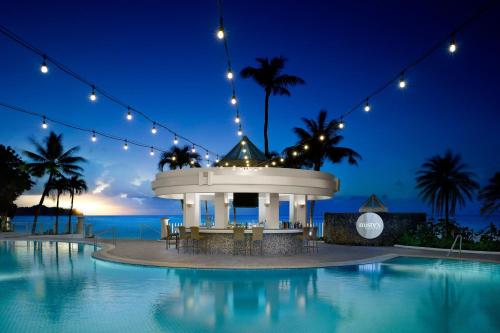 a pool at night with a gazebo at The Westin Resort Guam in Tumon
