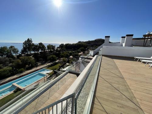 a balcony of a house with a swimming pool at Luxury Sea View Penthouse by United Renters in Villajoyosa